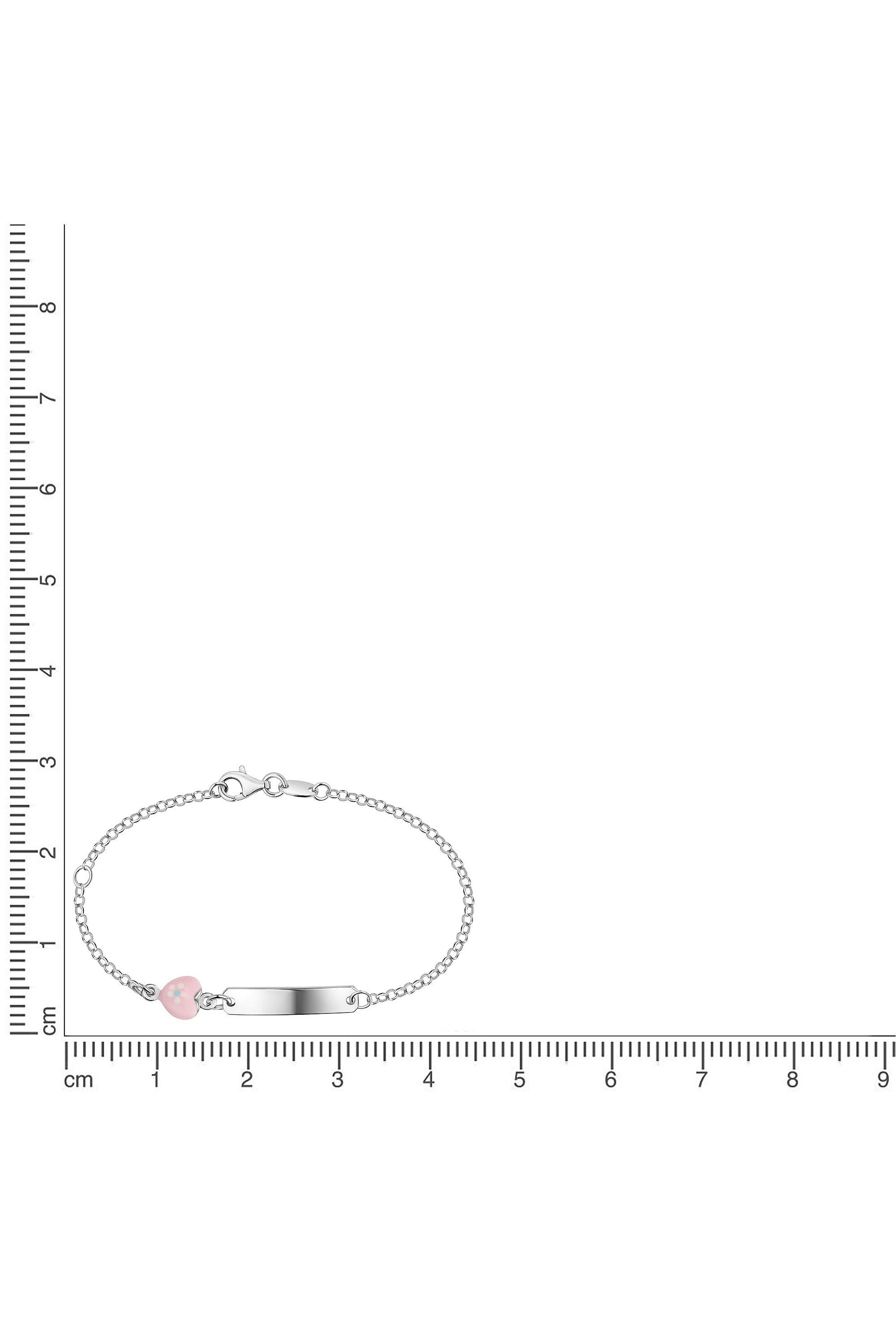 Silbernes Scout Armband mit rosa Herz neben einem Lineal zur Größendarstellung