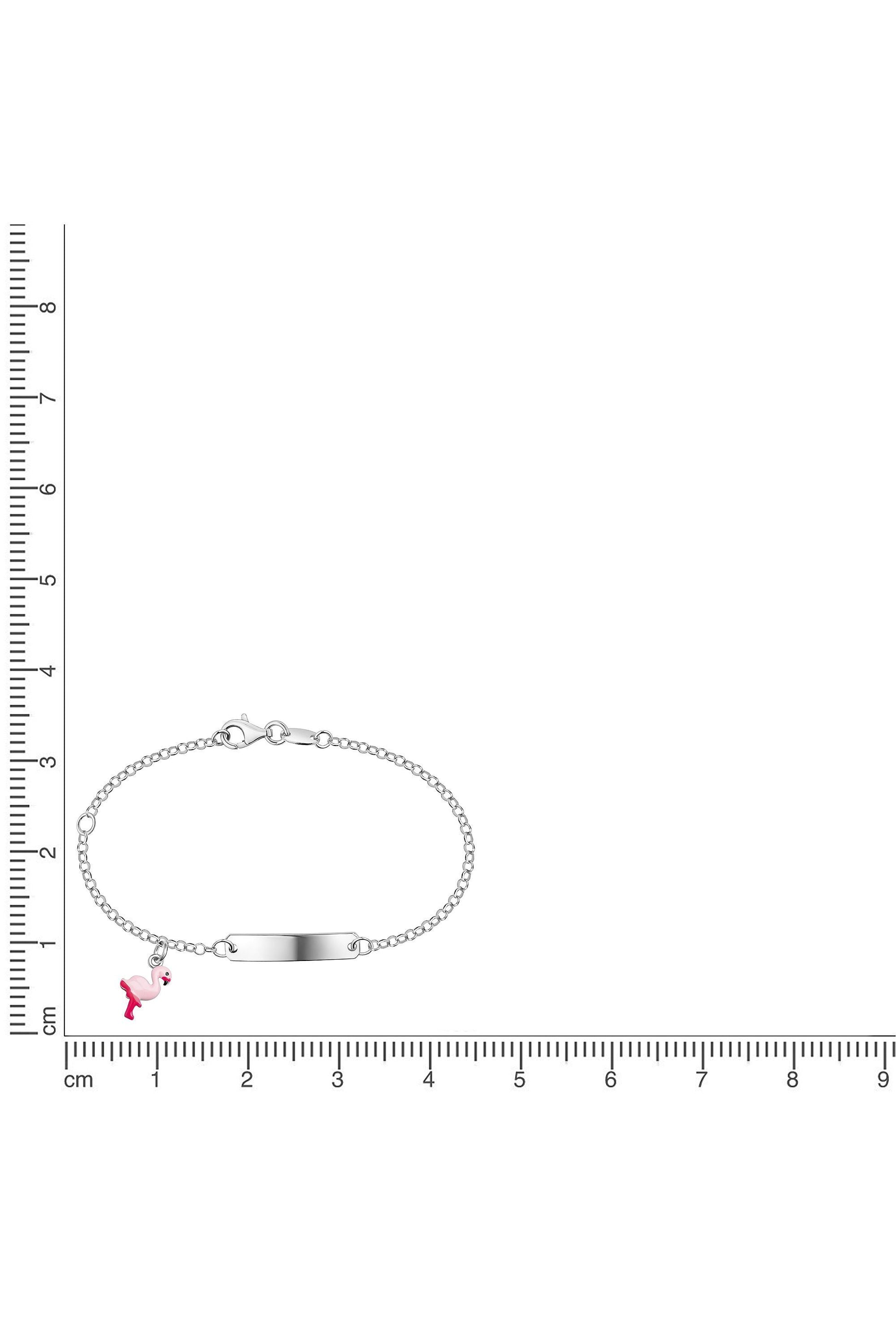 Silbernes Scout Armband mit pinkem Flamingo neben einem Lineal zur Größendarstellung