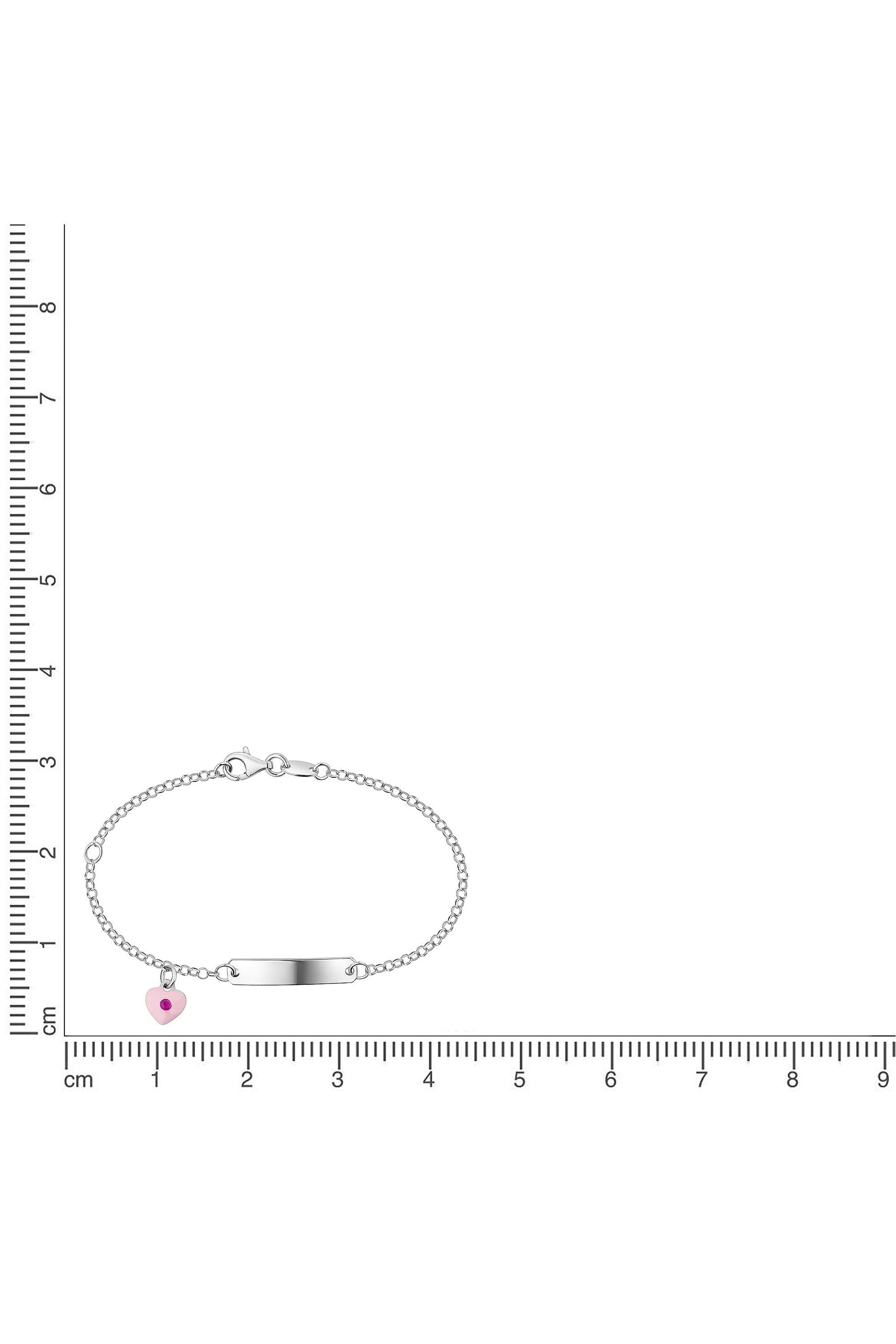 Silbernes Scout Armband mit Herz und rosa Kristall neben einem Lineal zur Größendarstellung